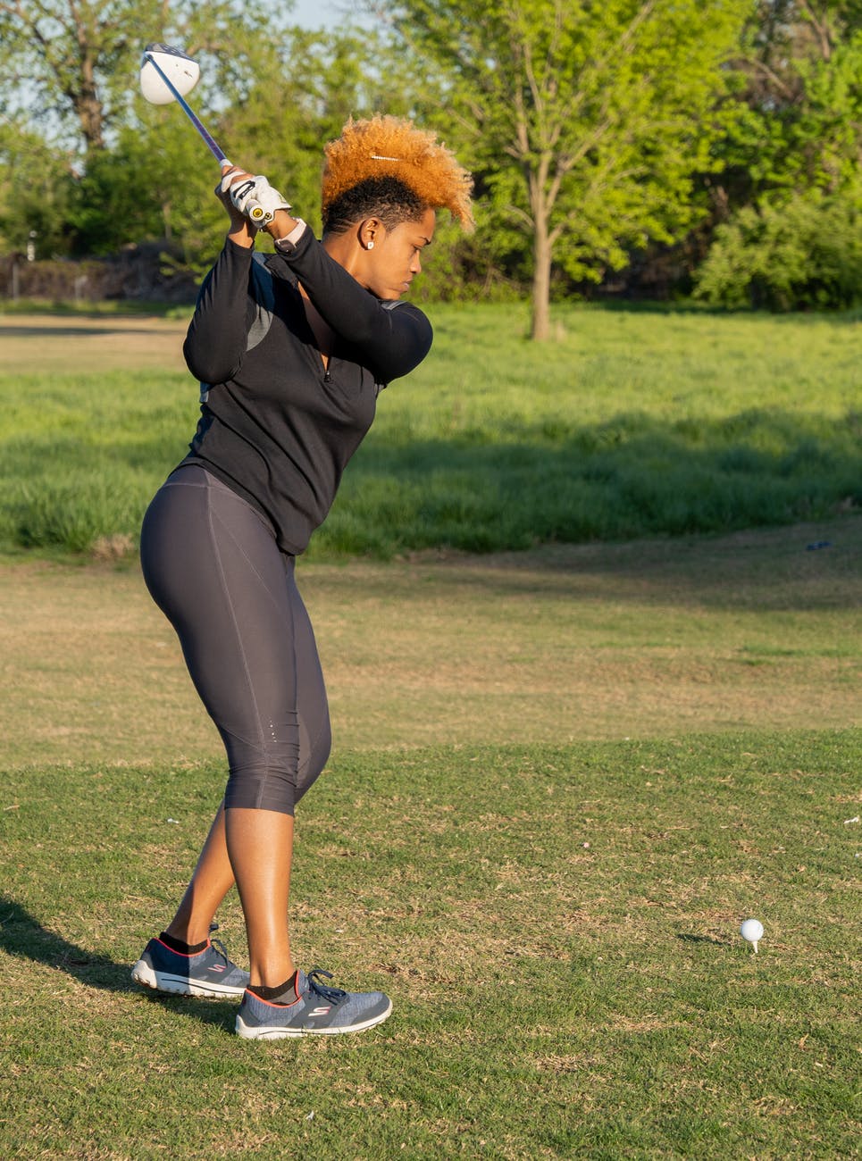 a woman playing golf